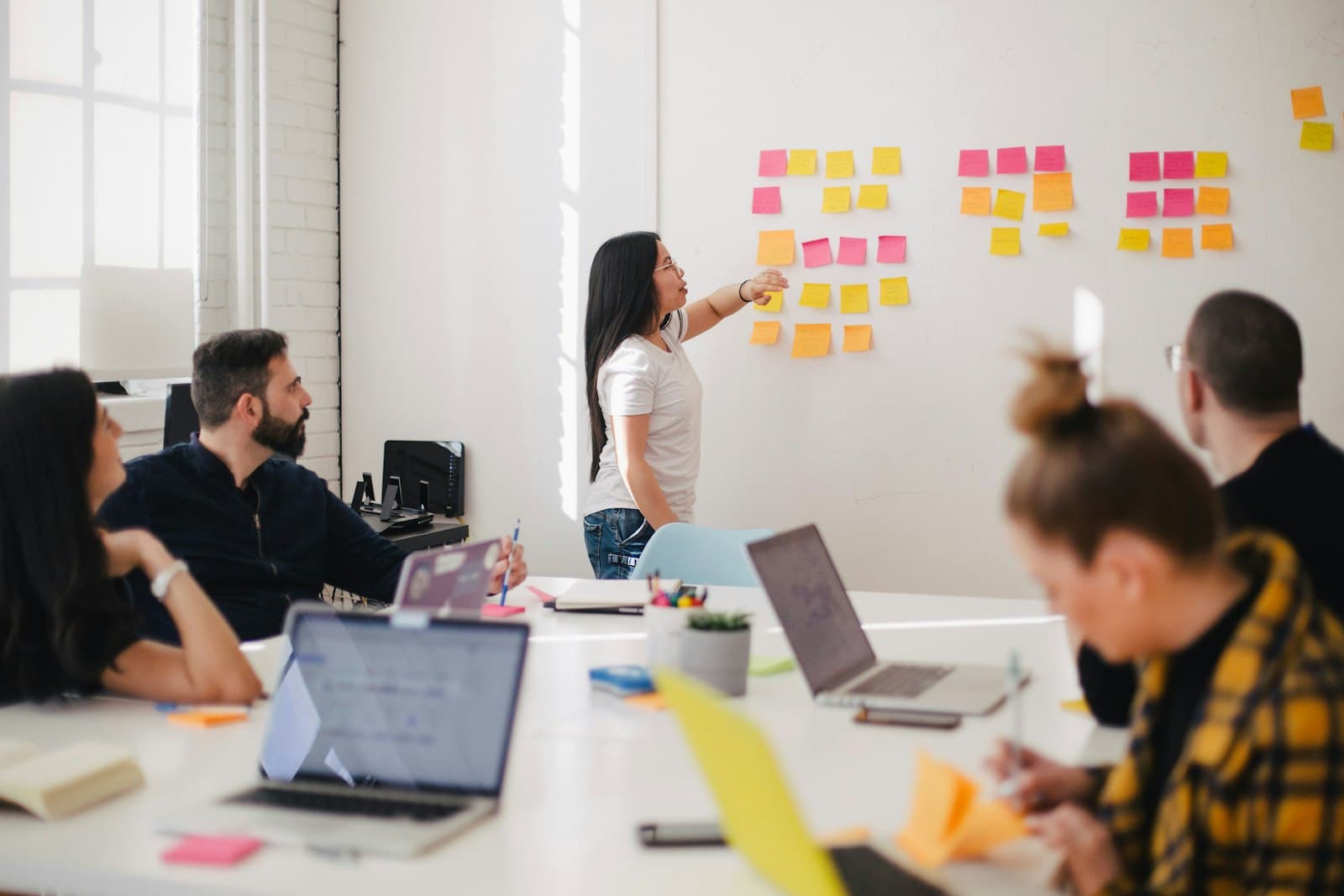A planning session at a wall of sticky notes